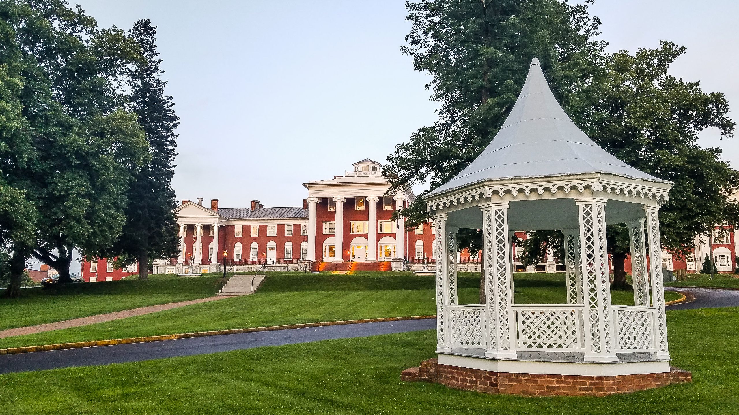 Image of the exterior of hotel and gazebo at Blackburn Inn. The Blackburn Inn & Conference Center, a member of Historic Hotels since 2018, dates to 1828. It is located in Staunton, Virginia.